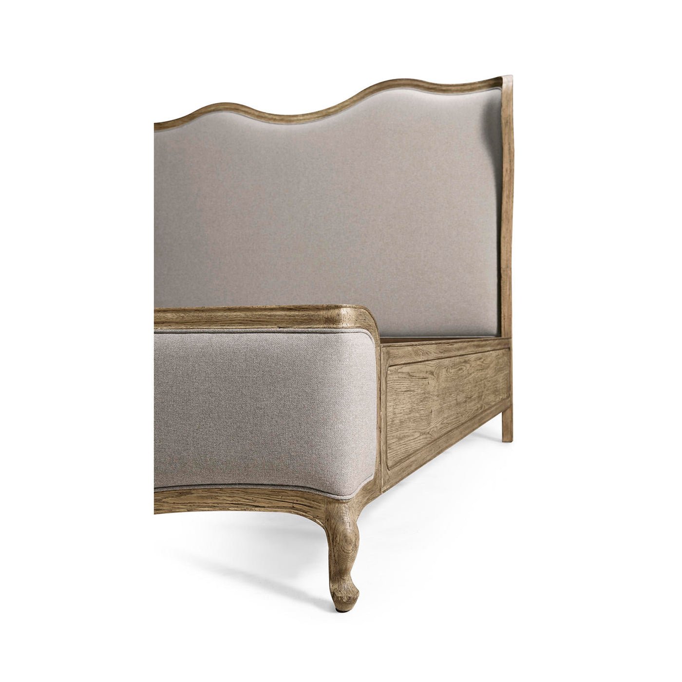 French Provincial bed corner with upholstery and wood.