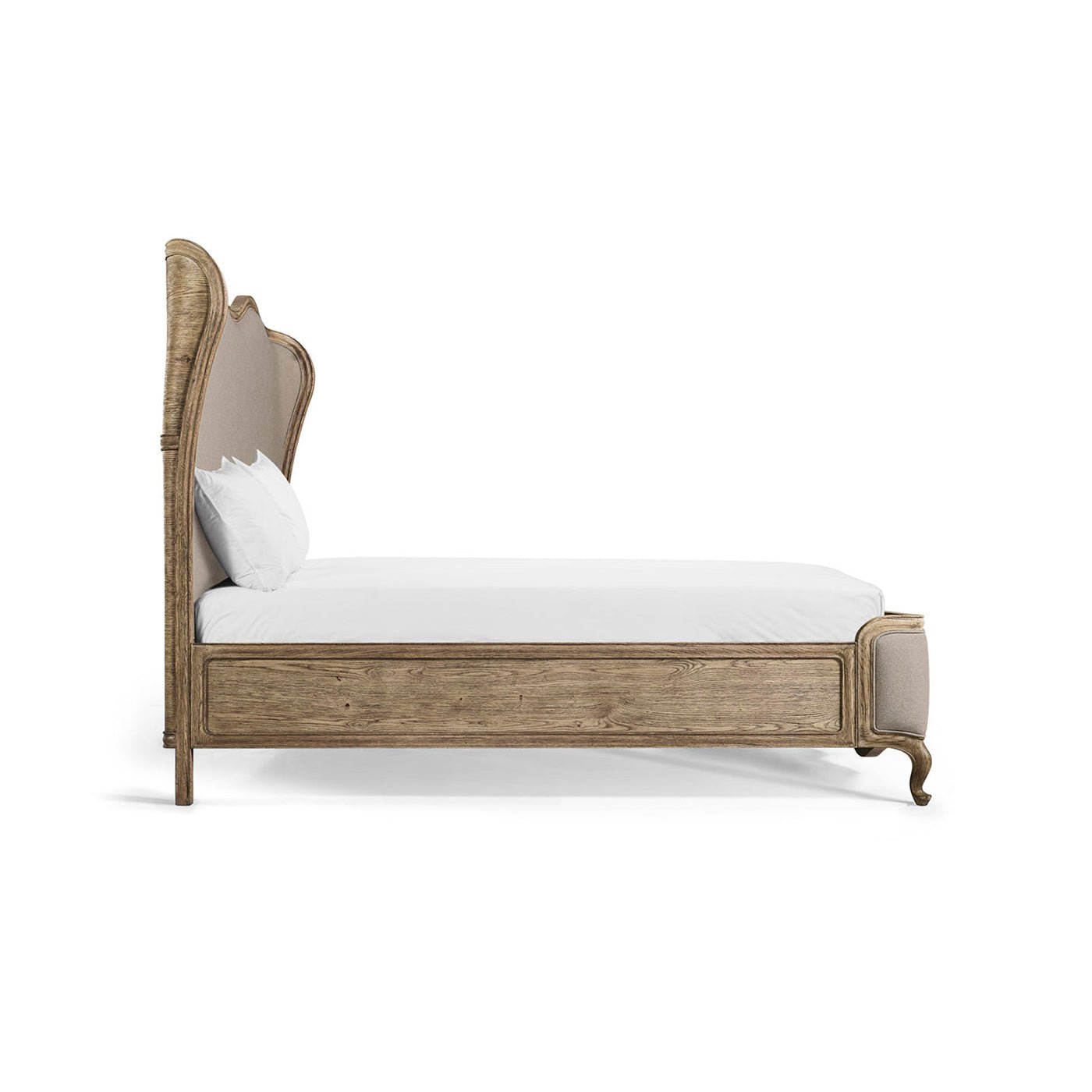 Side profile of French Provincial upholstered oak bed.