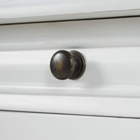 Close-up of knob on white end table drawer.