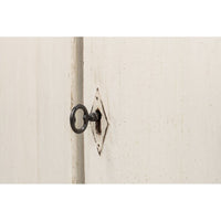 Close-up of keyhole on the sideboard door.