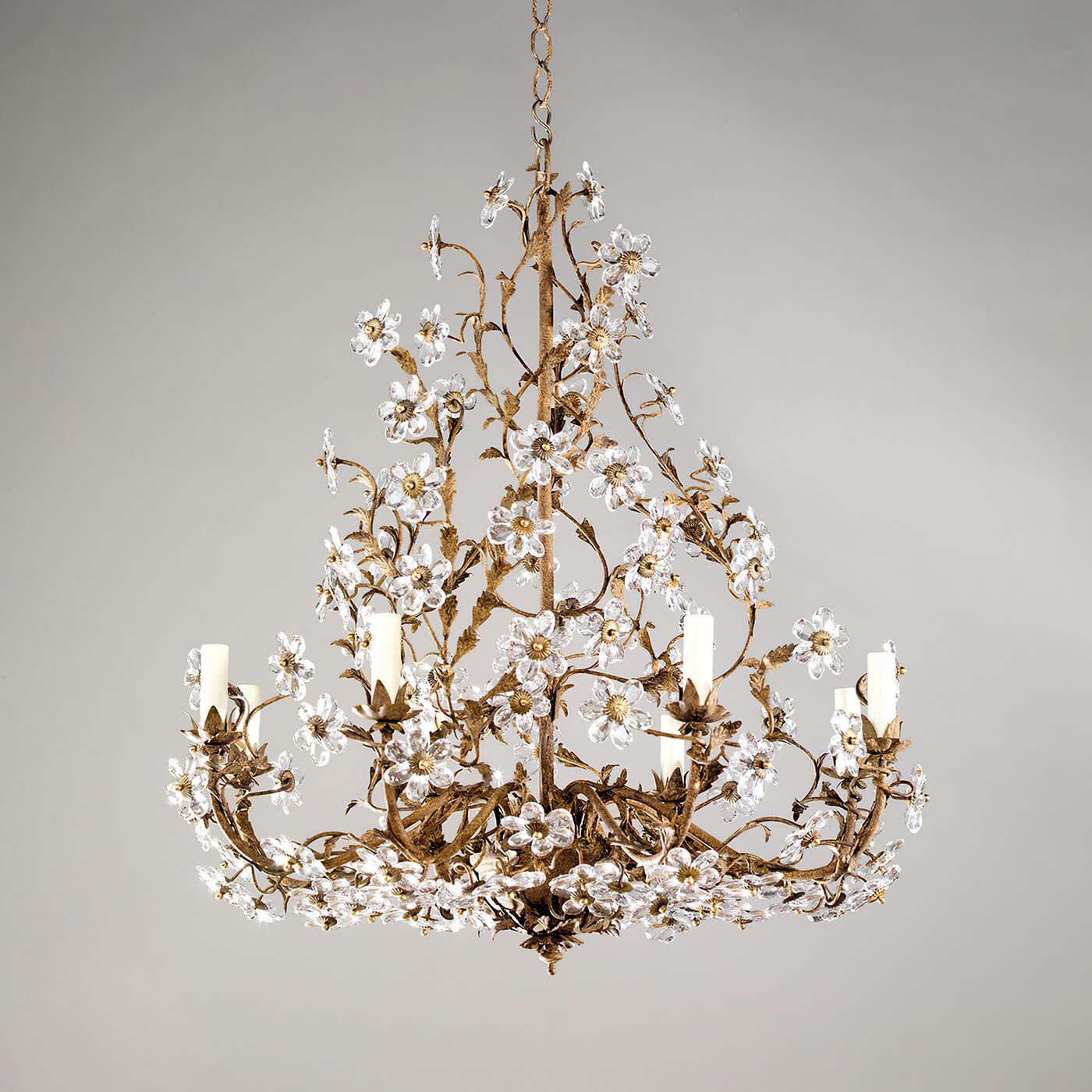 Rustic chandelier featuring intricate crystal flower designs.