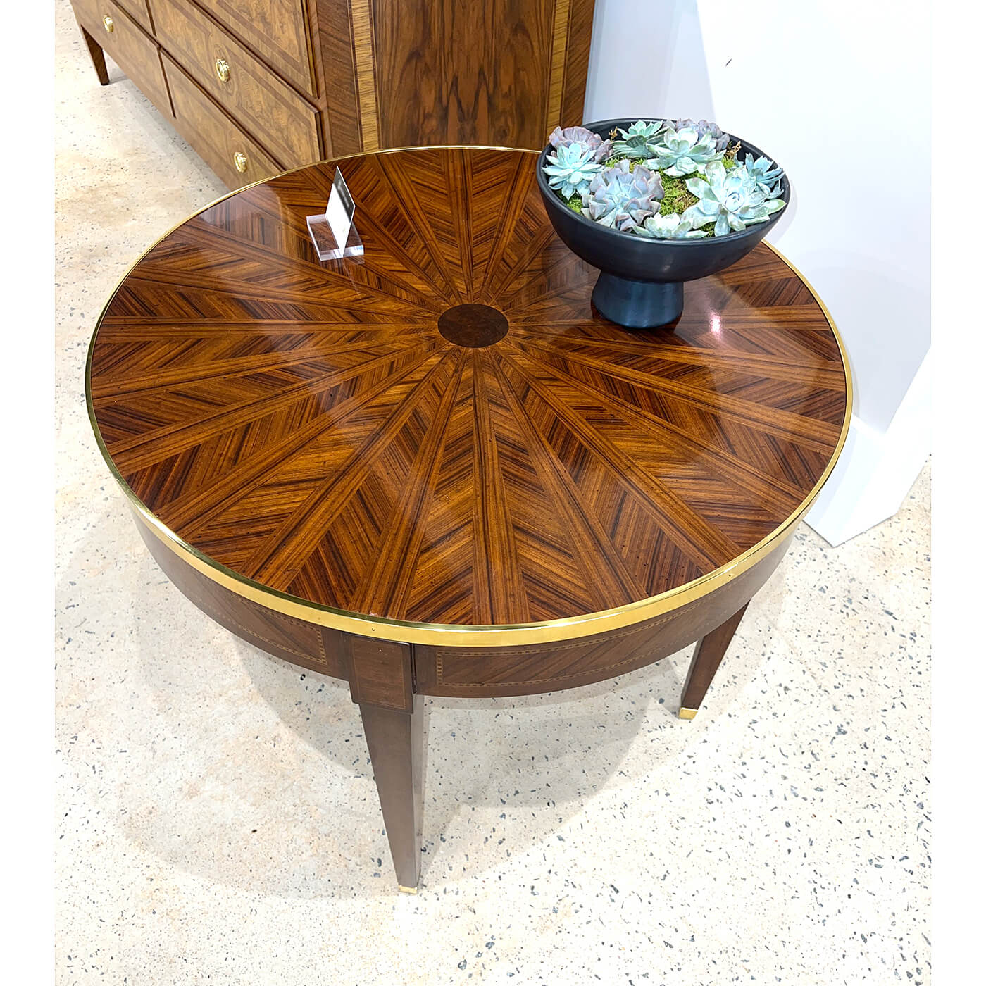 Top angle view of parquetry side table with plant display.