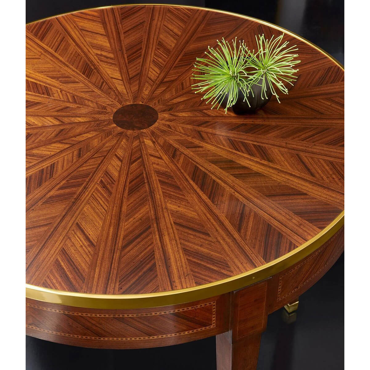 Detailed top view of round parquetry side table design.