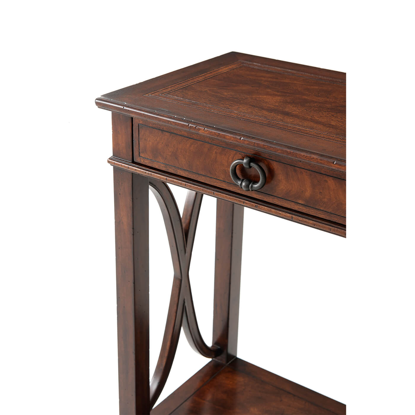 Corner detail of wooden console table with decorative base.