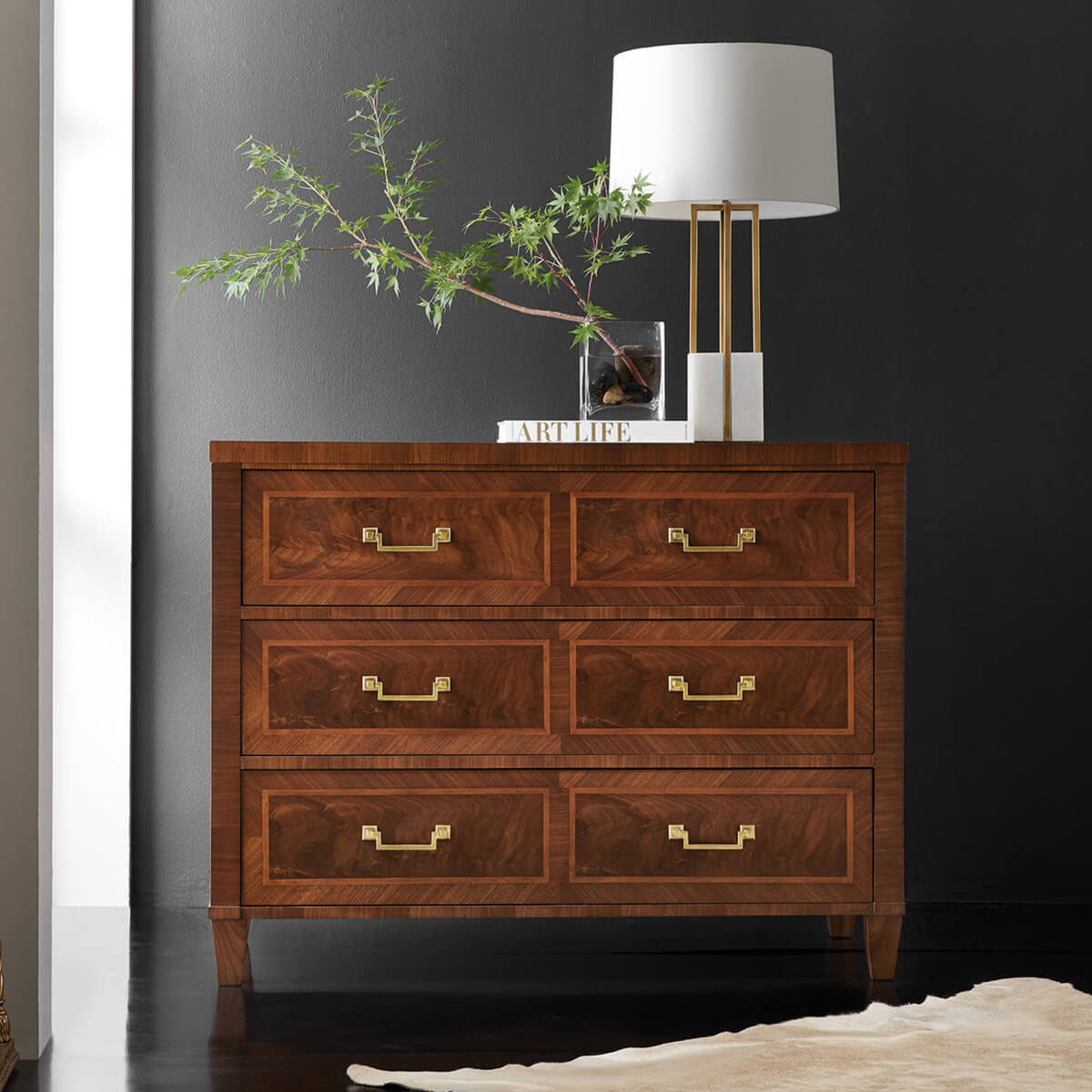 French style chest of drawers, styled in dark room.