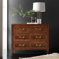 French style chest of drawers, styled in dark room.
