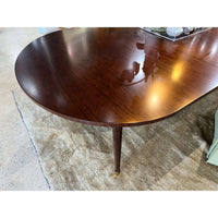 Glossy finish of French walnut dining table surface.