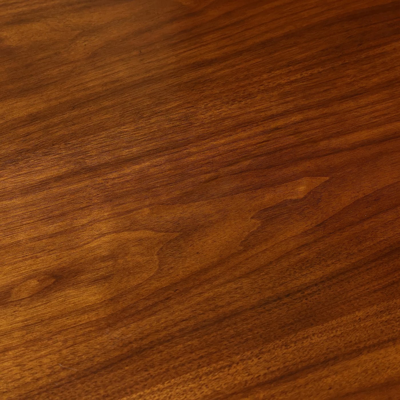 Wood grain detail on French walnut dining table surface.