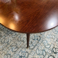 Smooth surface finish of French walnut dining table.