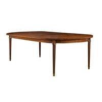 Elegant French walnut dining table on white background.