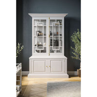 Display cabinet in room with books, decor items.
