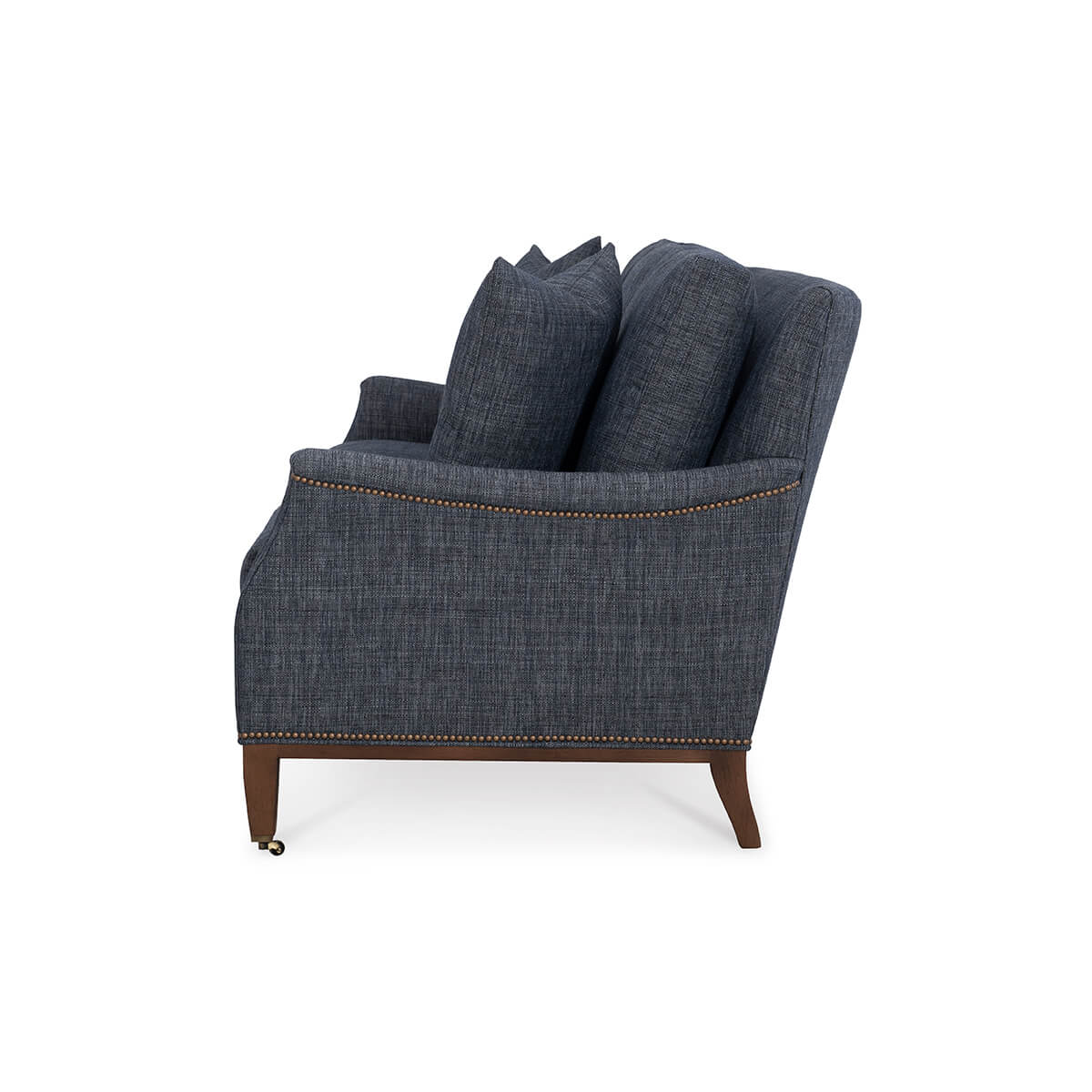 Side profile of blue Galvin Classic Sofa with nailhead trim.