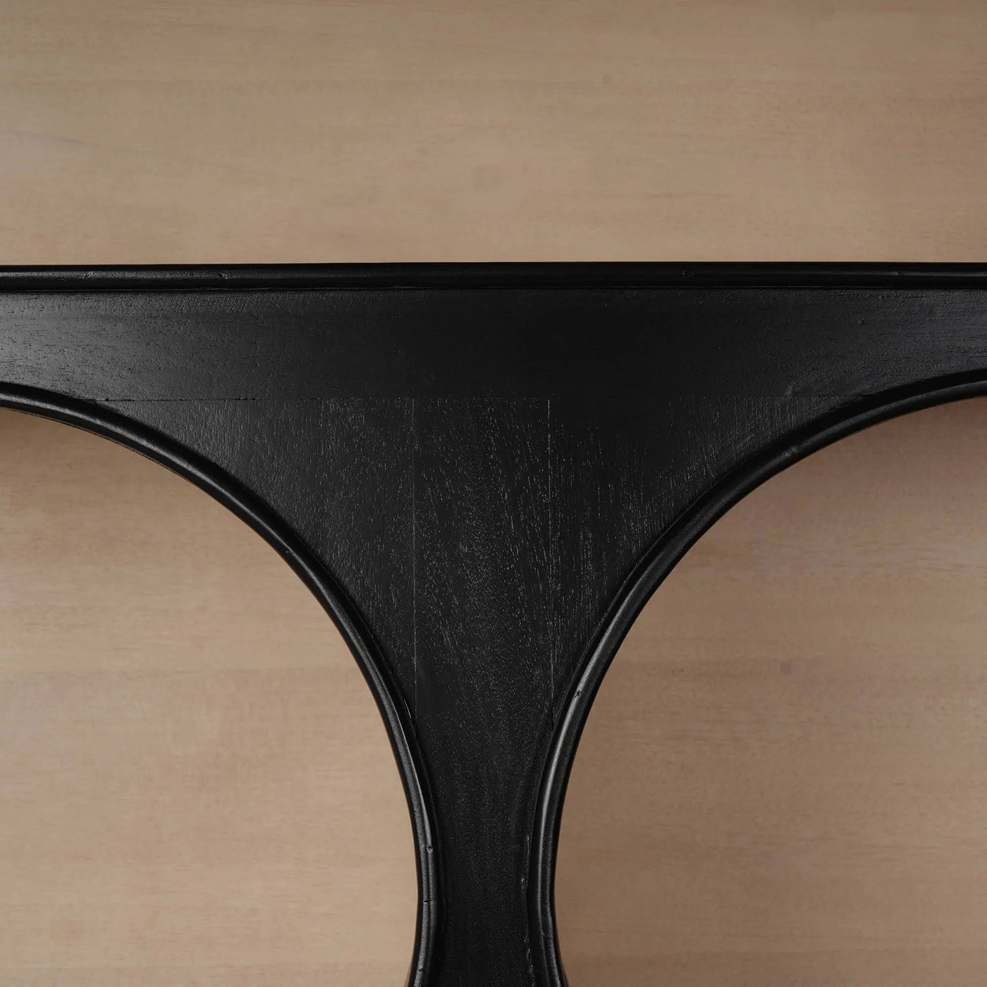 Black geometric frame detail of mid-century bookcase.