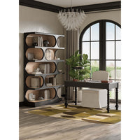 Bookcase with decor, stylish office interior, large window.