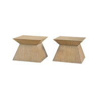 Set of geometric pedestal coffee tables, angled view.