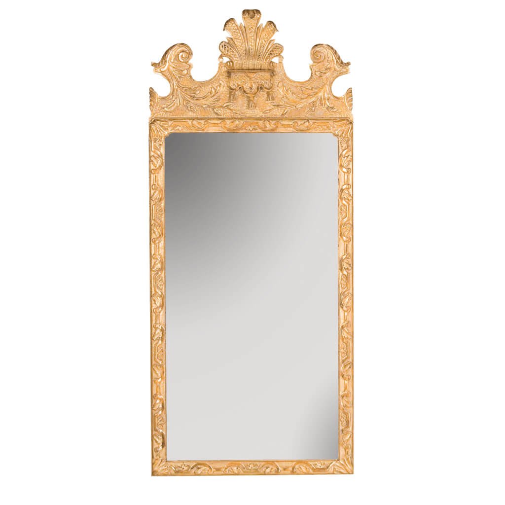 Ornate George I mirror with carved wood frame.