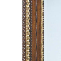 Close-up of intricate George II mirror border design.