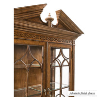 Close-up of decorative top on mahogany bookcase.