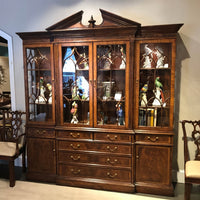 George II bookcase in showroom, decorative items displayed inside.