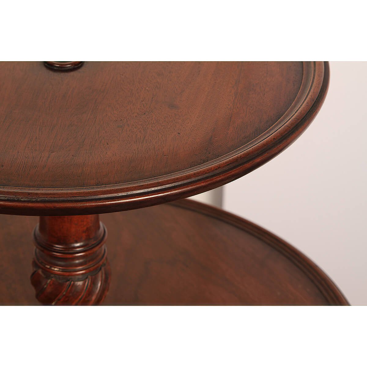 Close-up of upper tiers on mahogany dumbwaiter.