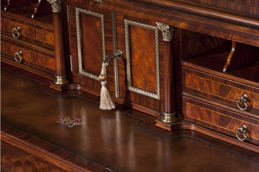 Close-up of ornate lock on secretary bookcase.