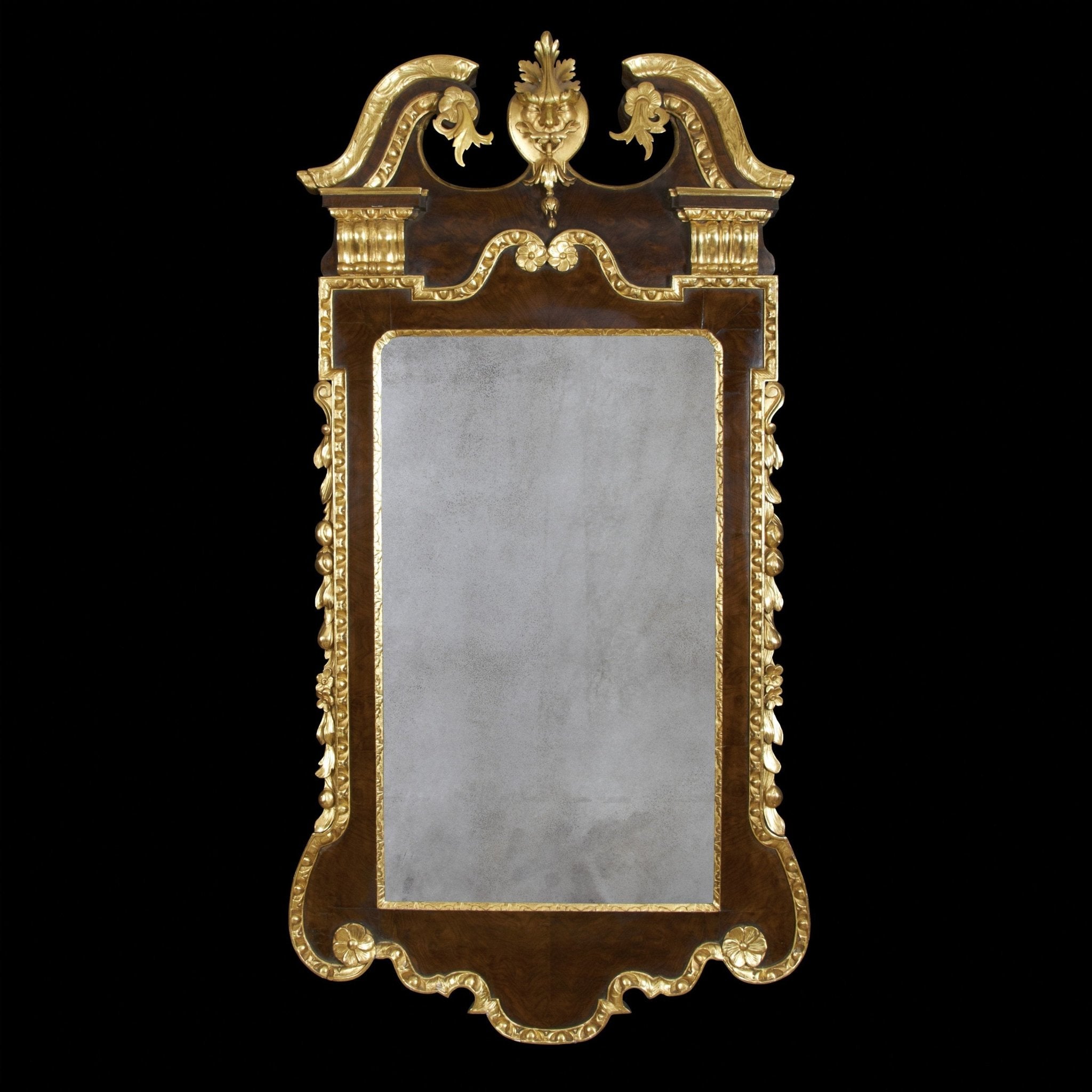 George II mirror on black background, gold detailing.