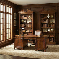 Office with two walnut bookcases and a desk.