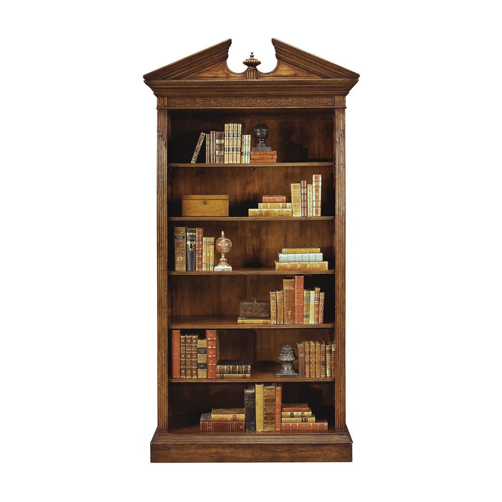 Walnut bookcase filled with books and decor items.