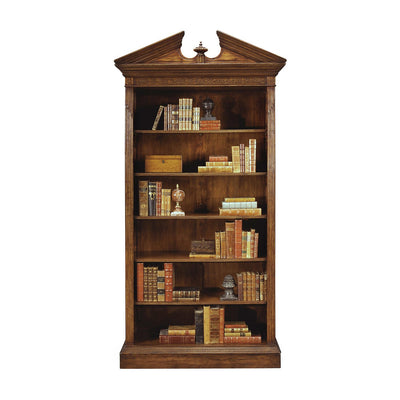 Walnut bookcase filled with books and decor items.