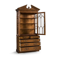 Walnut bookcase with one door open, empty shelves.