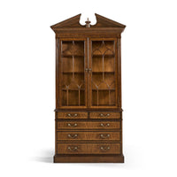 Front view of closed walnut bookcase.