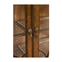 Close-up of door handles on walnut bookcase.