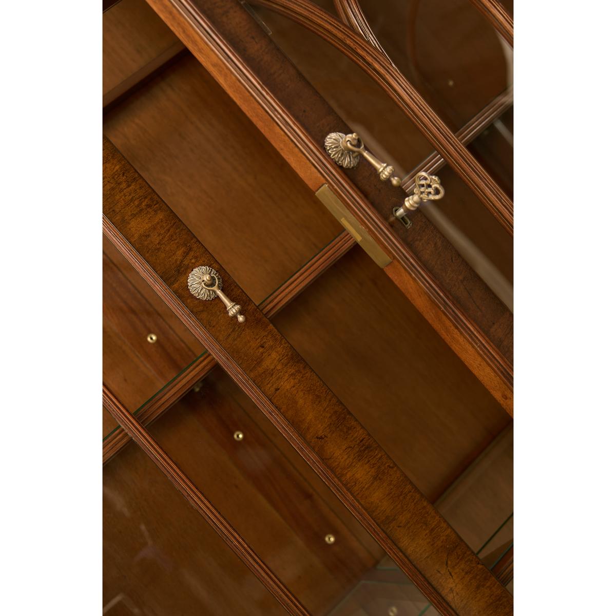 Detailed lock mechanism of walnut display bookcase.