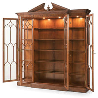 Open walnut display bookcase with interior lighting.