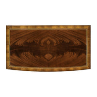 Top view of bow front bedside dresser with wood grain.
