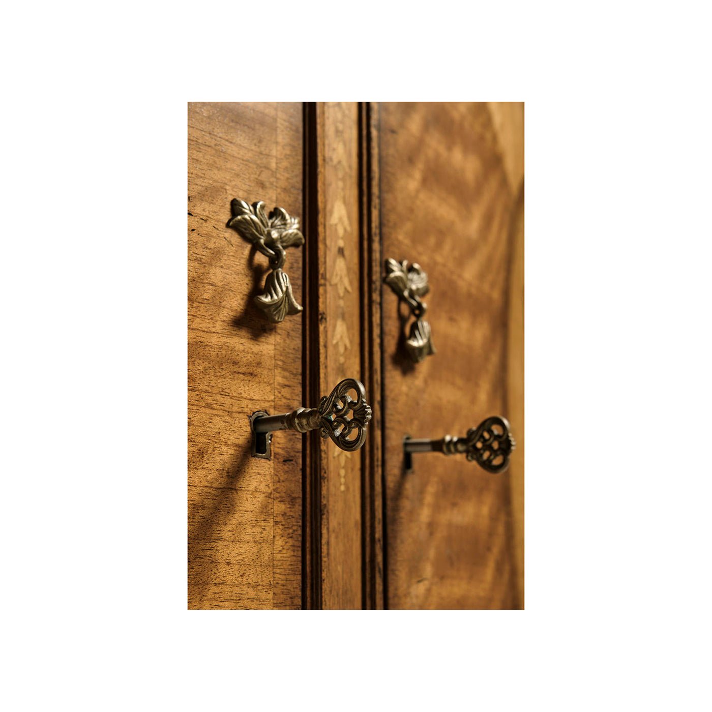Close-up of George III cabinet locks and decorative keys.