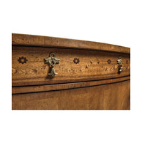 Drawer detail on Hepplewhite cabinet with floral knobs.