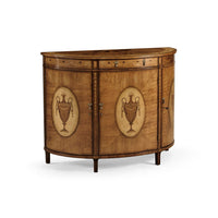 Angled view of Hepplewhite demi-lune cabinet with urn motif.