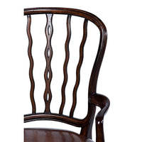 Backrest detailing of mahogany dining armchair.