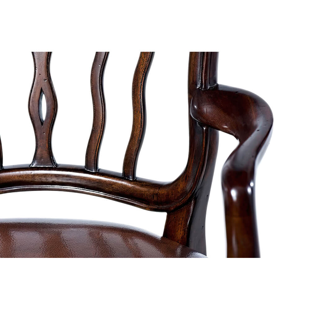 Close-up armrest of mahogany dining armchair.