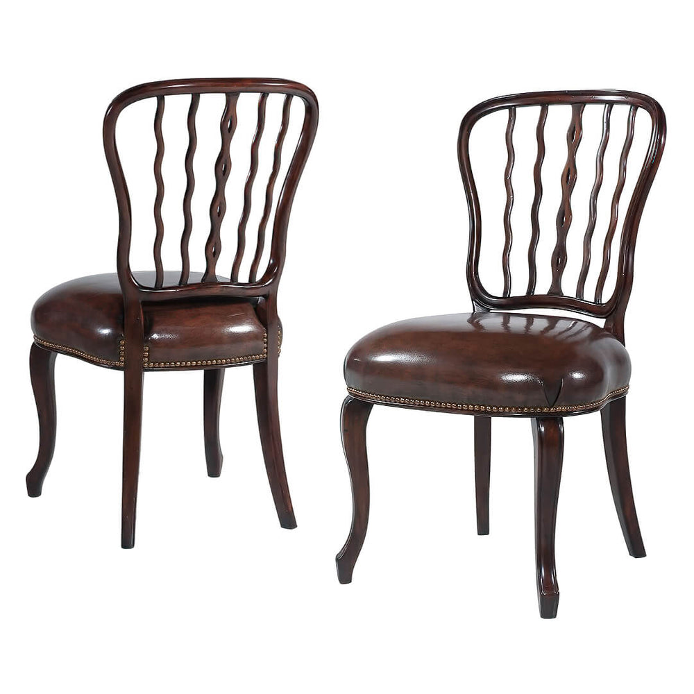Pair of mahogany dining chairs, front view.