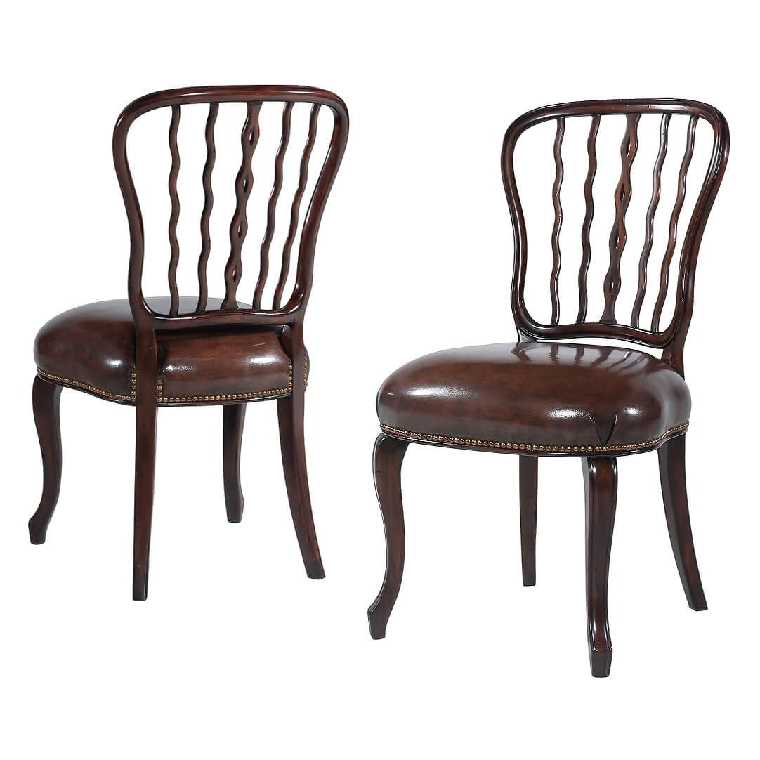 Pair of mahogany dining chairs, front view.