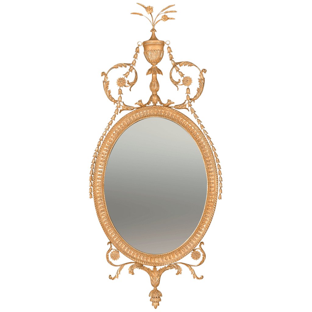 Ornate oval mirror with intricate gold frame design.