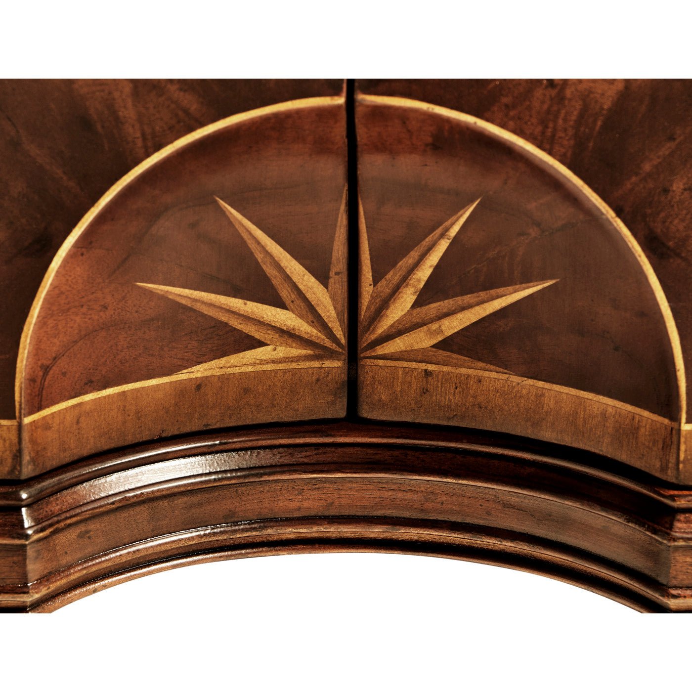 Close-up of sideboard arc with starburst inlay design.