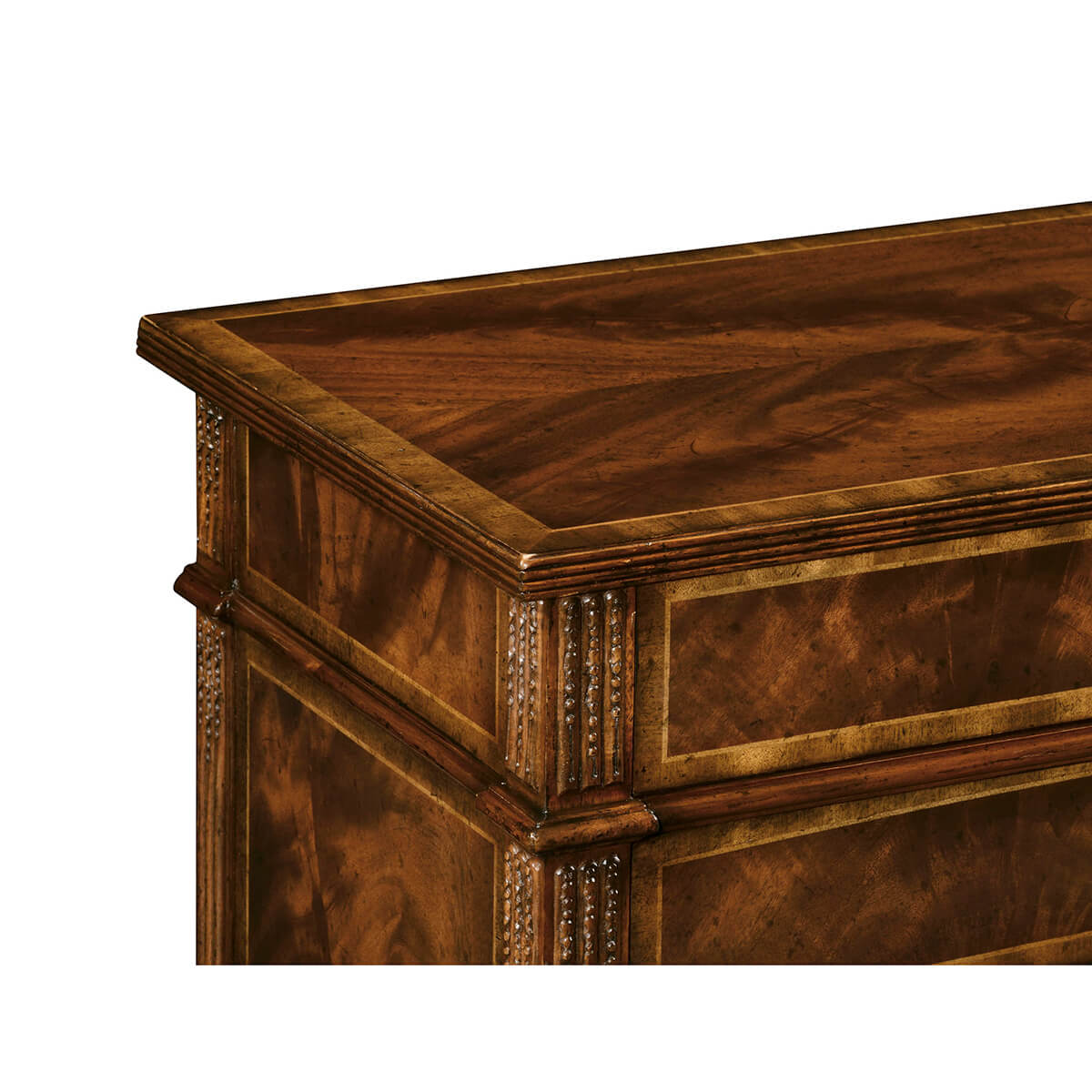 Detailed top corner of mahogany chest with carved edging.