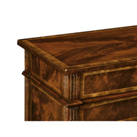 Detailed top corner of mahogany chest with carved edging.