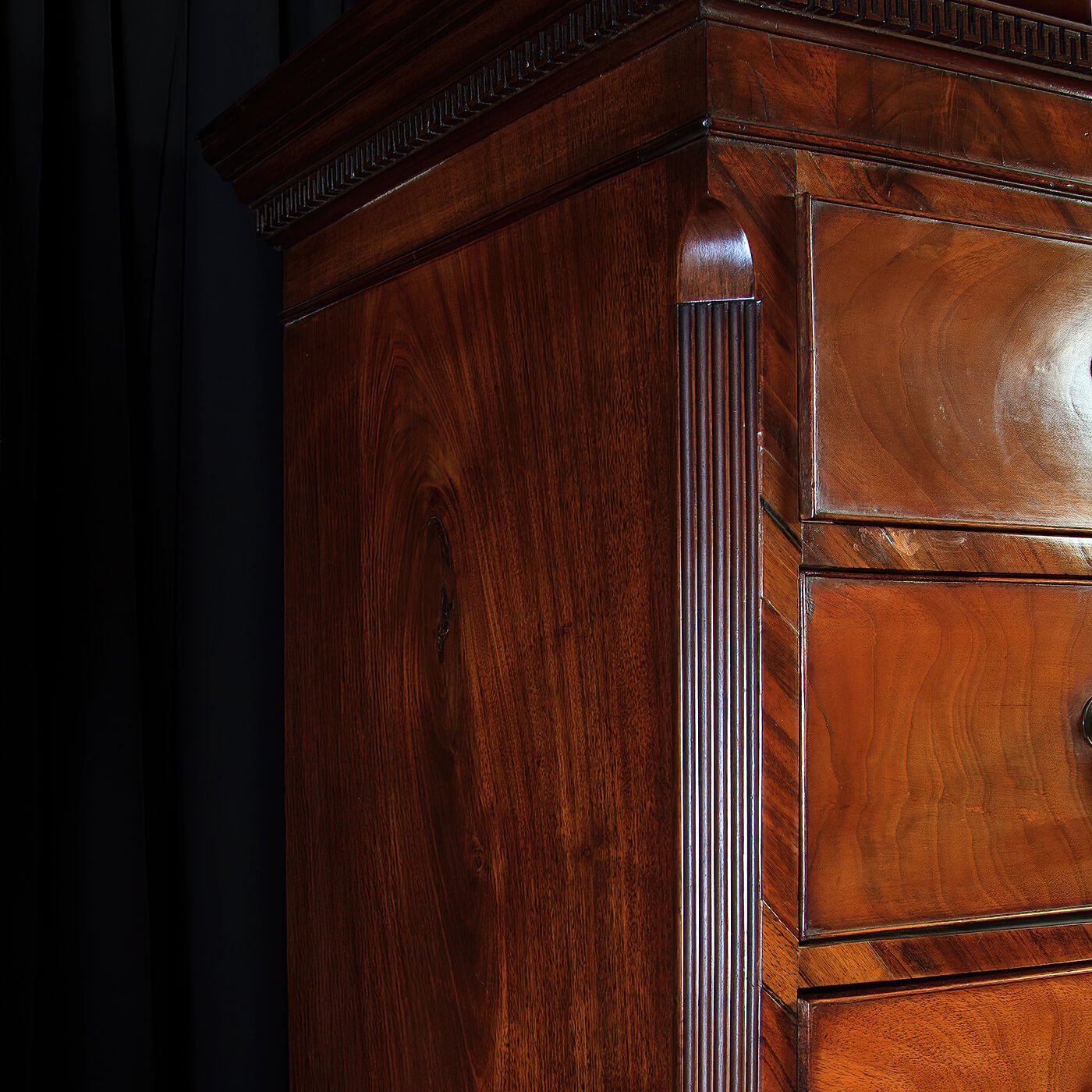 Side view of chest highlighting wood finish.