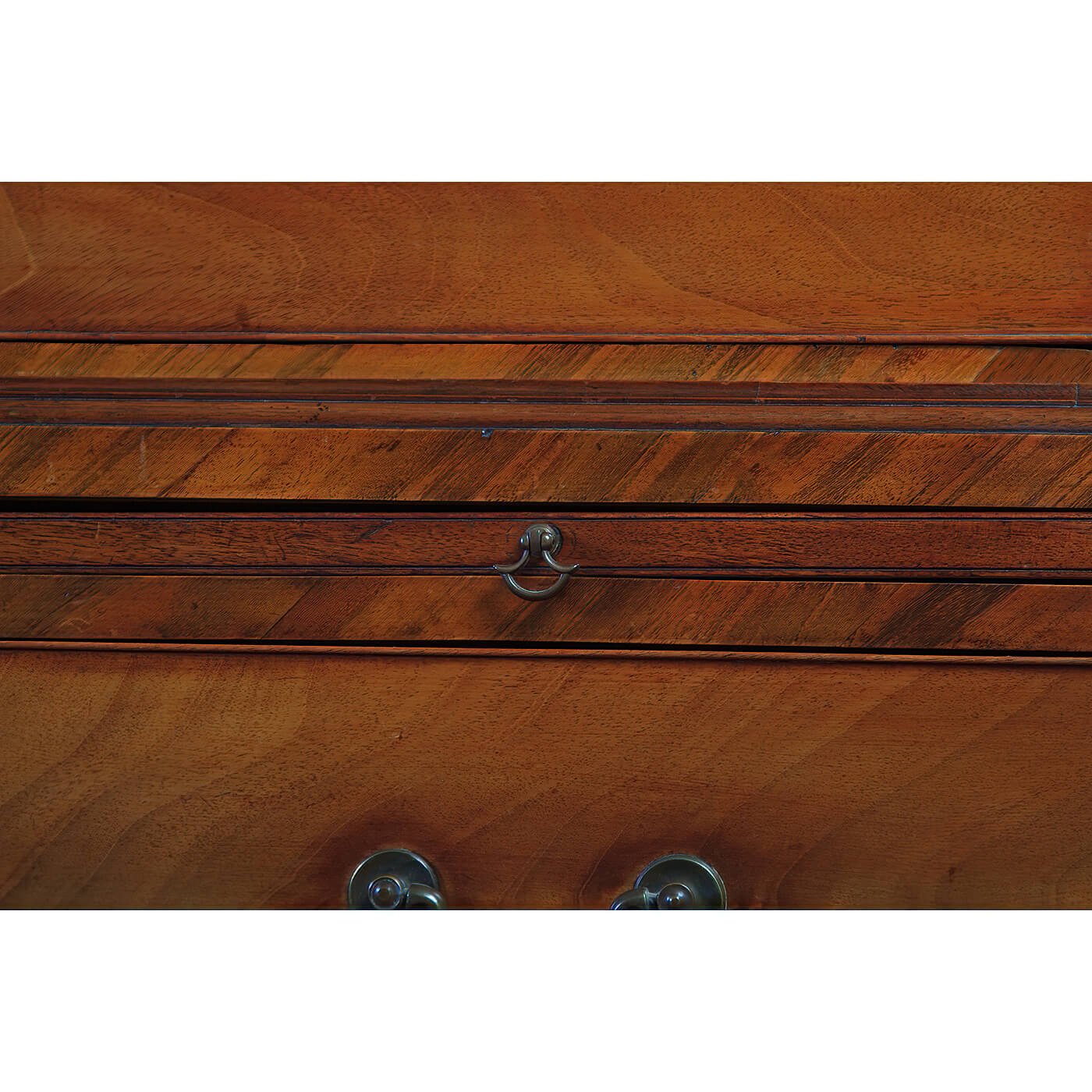 Drawer lock detail on mahogany chest.