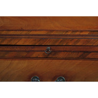 Drawer lock detail on mahogany chest.