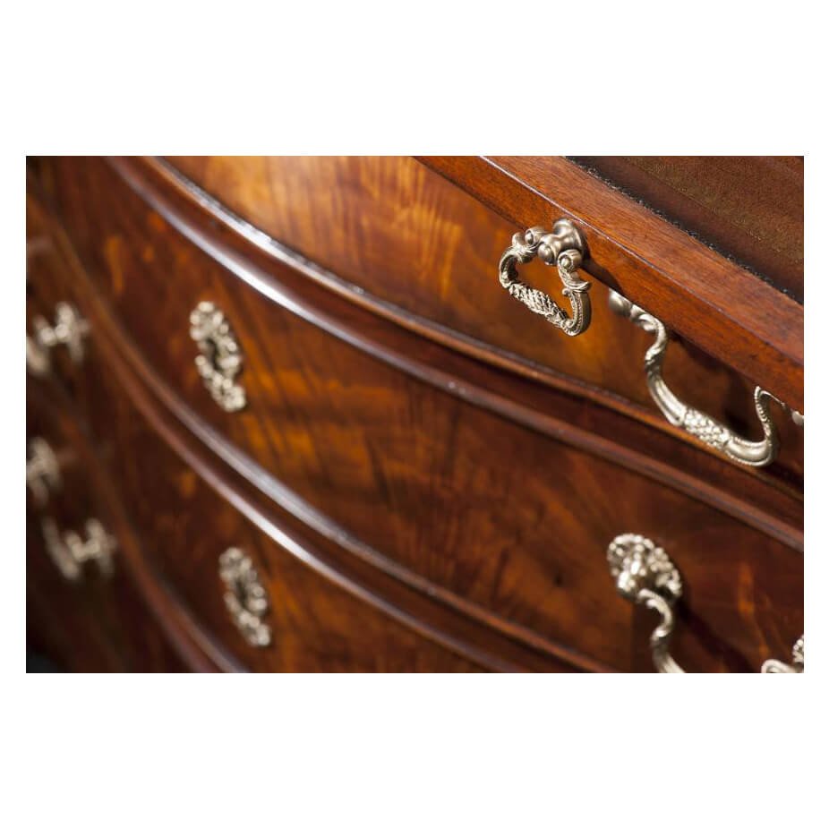 George III mahogany chest, close-up of brass handles and wood.